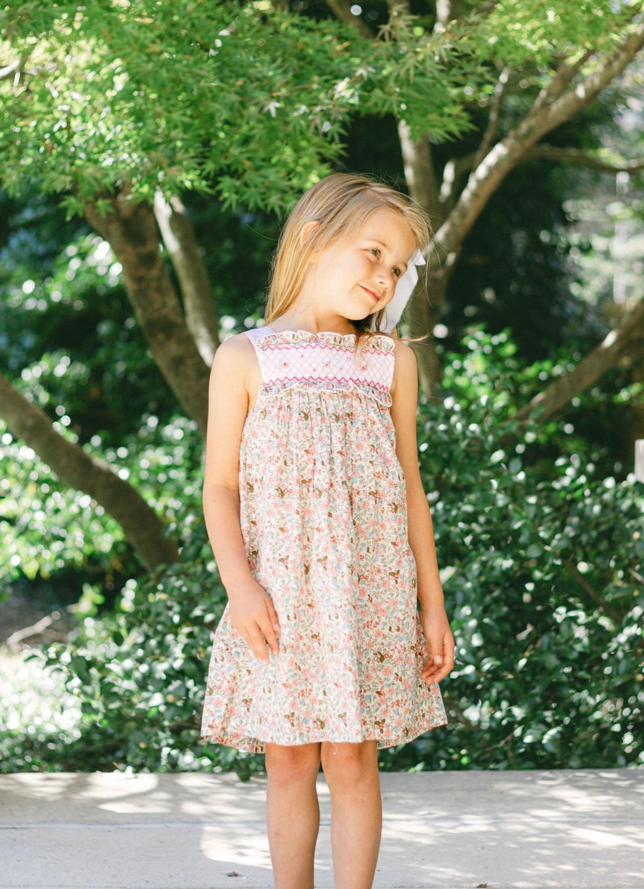 Sleeveless floral hand smocked dress with geometric smock and back sashes 6M