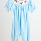 Blue puppy hand smocked girl romper