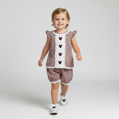 Toddler wearing Miss Mouse embroidered red and black seersucker set with mouse design and matching shoes