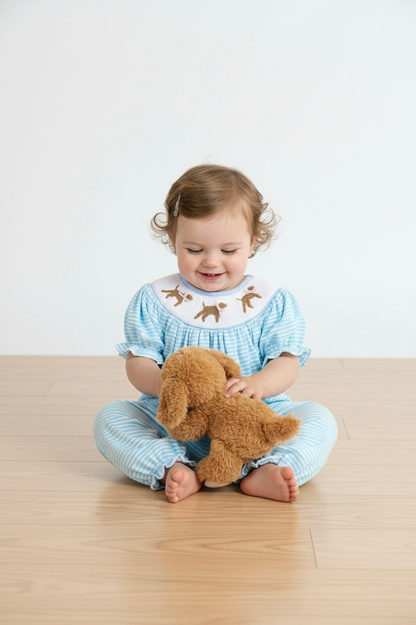 Blue puppy hand smocked girl romper