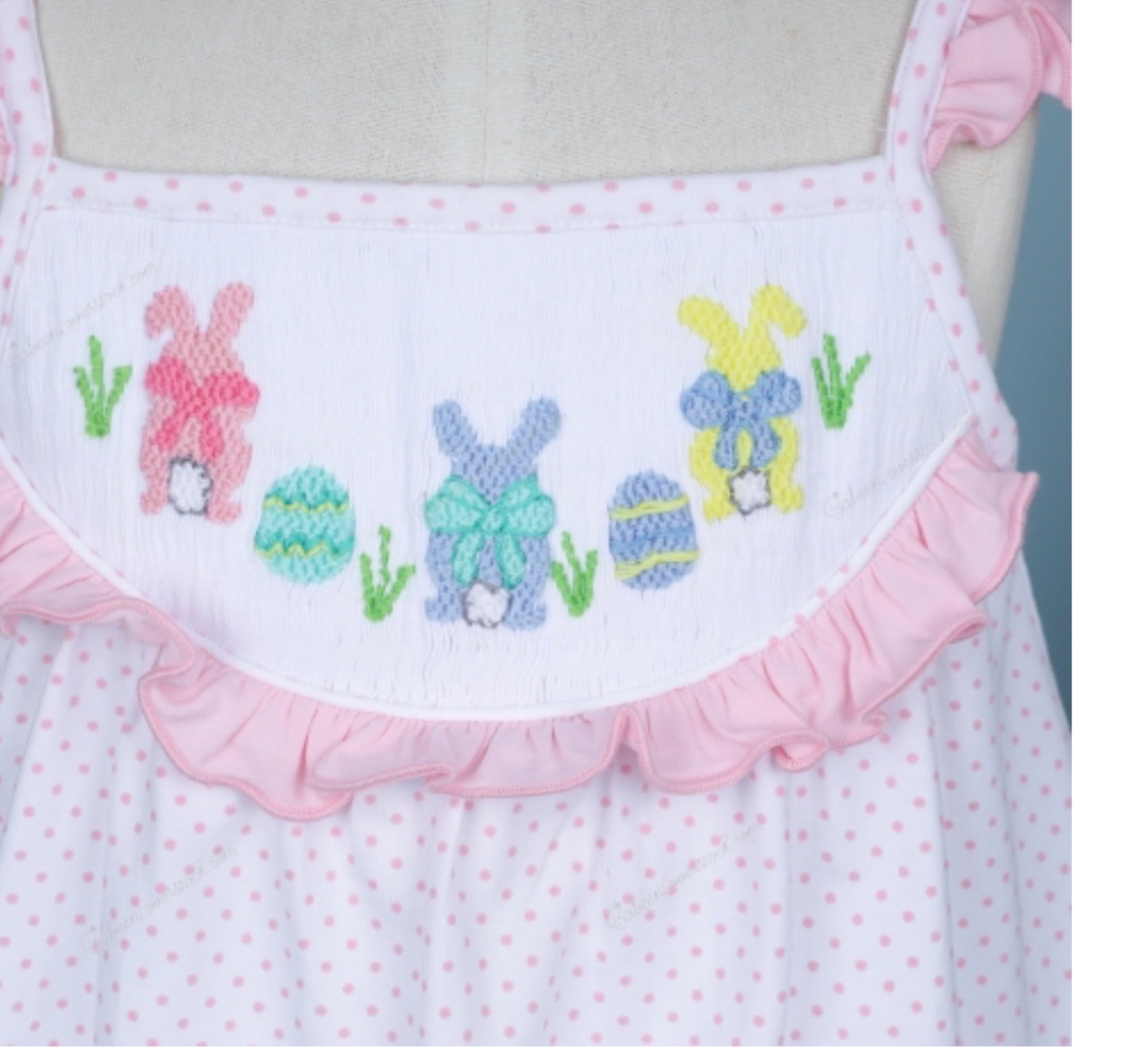 Hand-smocked Easter theme in white with tiny pink dot printed fabric dress
