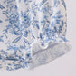 BLUE FLORAL CROSS SMOCKED RUFFLE BUBBLE