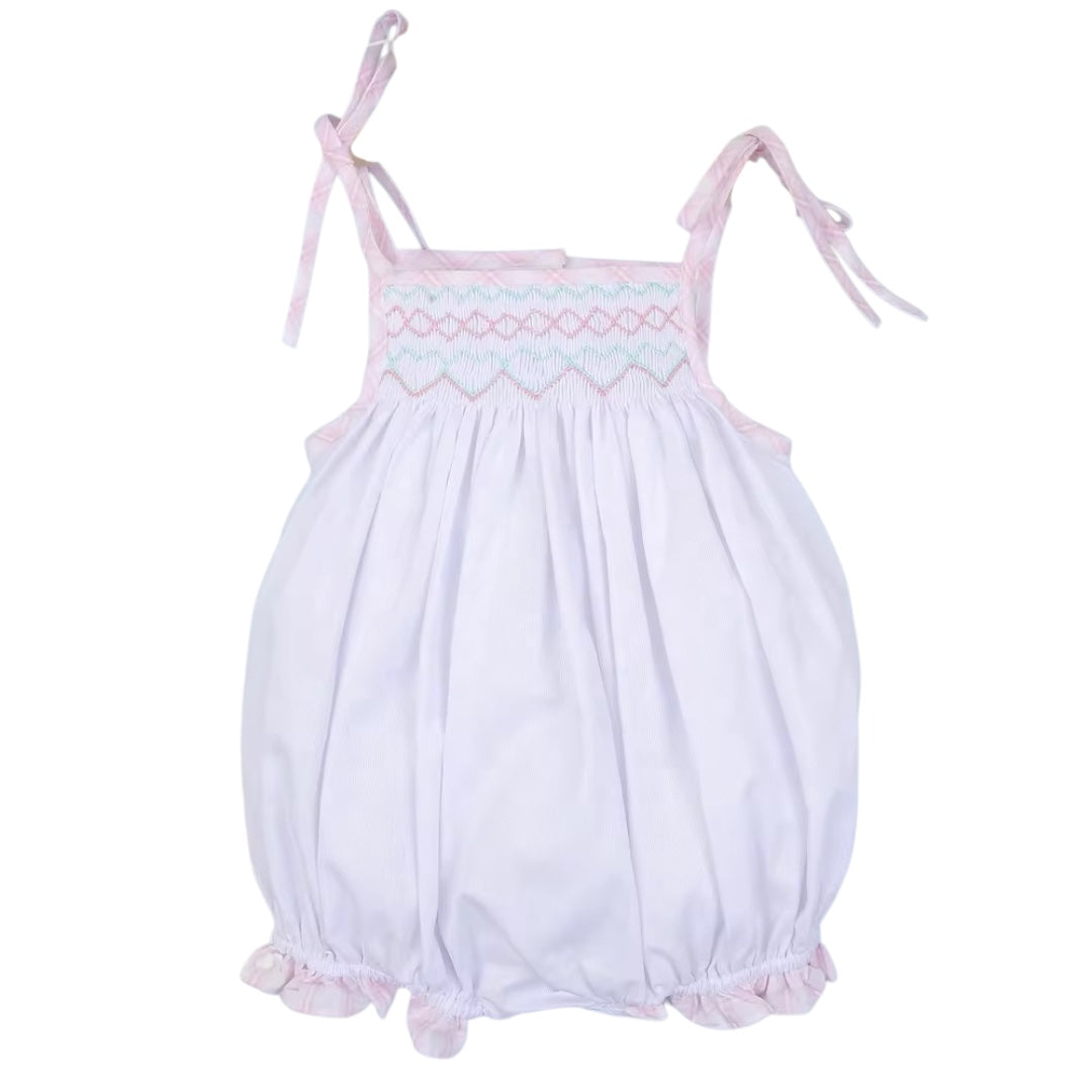 Geometric Handsmocked baby bubble with pink straps and ruffle bottom for girls