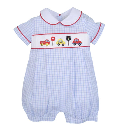 Boy's blue hand-smocked bubble with car and traffic light design on chest